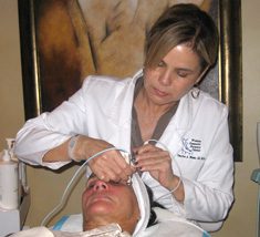 Belinda Piaget working on a patient's forehead